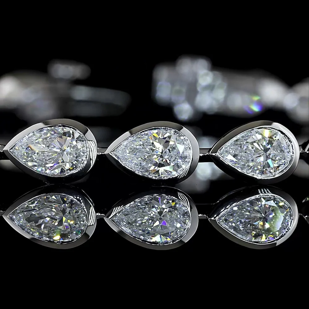 14K White Gold Tennis Bracelet with East-West Bezel Set Pear Shaped Lab Diamonds - 7.04 Carats Total Diamond Weight - Covaloro Fine Jewelry - Image 2